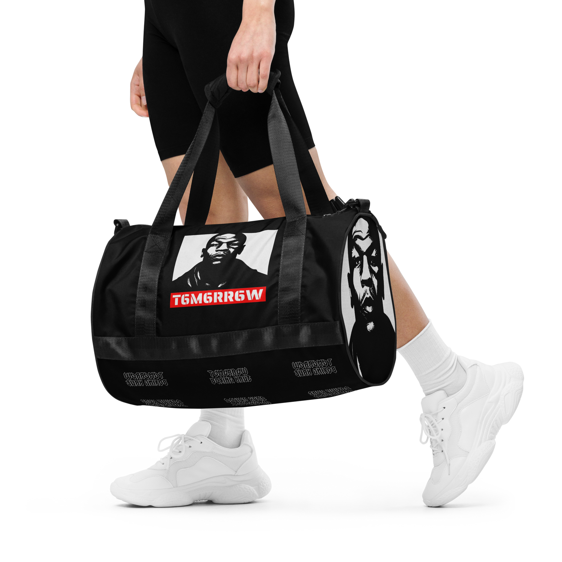 t6m6rr6w Tyson K.O. Code Fighter Gym Bag in black and white colorway. Front view shows iconic Mike Tyson portrait with red t6m6rr6w logo banner. Side views reveal all-over print design featuring multiple Mike Tyson images and repeated t6m6rr6w branding. Duffle-style gym bag with dual padded handles, adjustable shoulder strap, and boxing-themed graphics perfect for fighters and boxing fans.